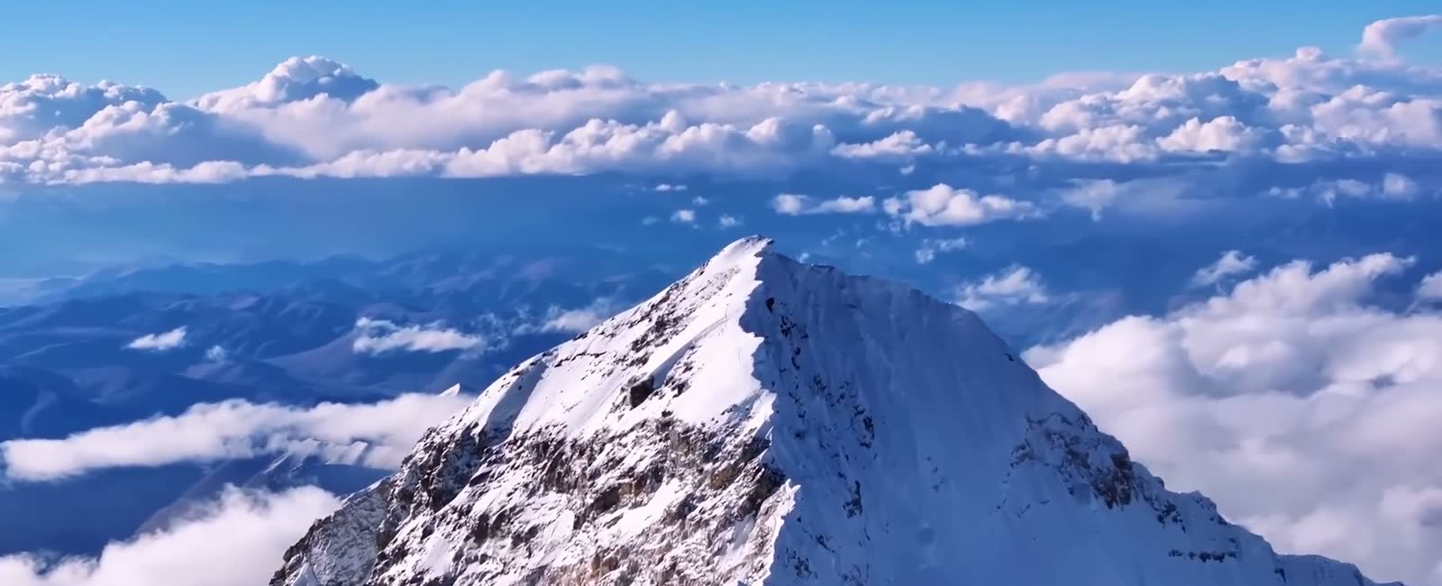 Aerial view of the summit of Everest above the clouds