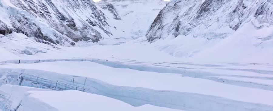 A single figure crossing the glacier