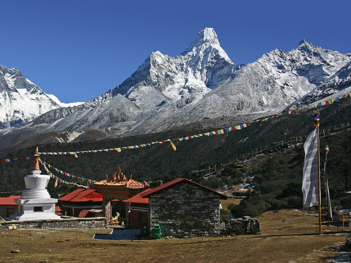 Stupa and prayer flags at Tengboche with Ama Dablam behind